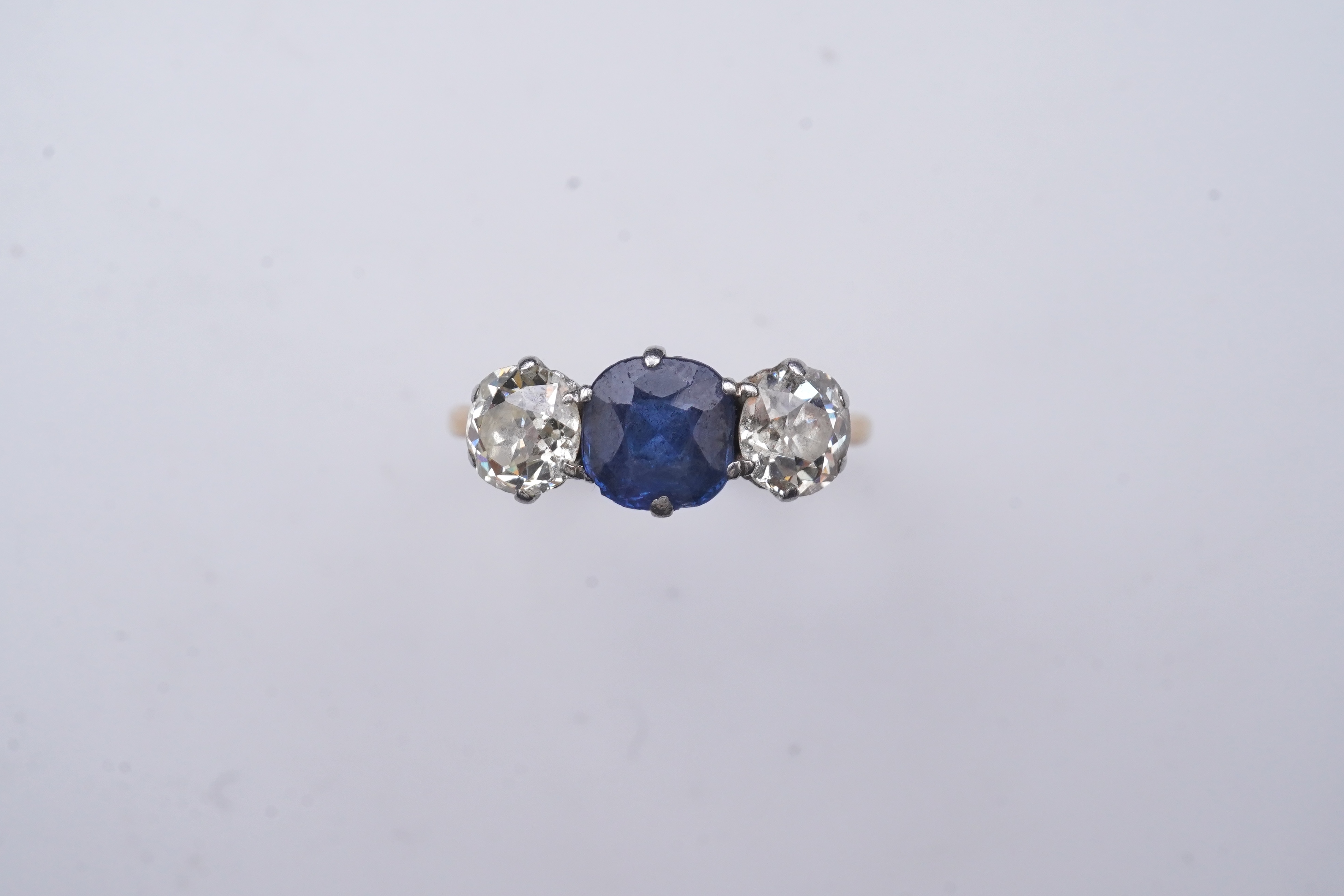 A sapphire and diamond three-stone ring, early 20th century